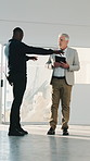 Engineer, team and talk with tablet for construction, planning and review progress of architecture. Men, point or digital at site for collaboration, inspection report and feedback on building project