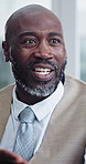 Financial advisor, talking and man with smile in meeting, budget review and planning for investment. Happy, mature wealth manager and black person with strategy, ideas and debt management in business