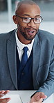 Financial advisor, talking and man with glasses in office, budget review or planning for investment. Eyewear, reflection and black person with ideas, wealth manager and advice for debt management