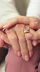 Person, holding hands and old woman at house for comfort, empathy and support for cancer diagnosis. Daughter, consoling and senior mother in lounge with sympathy, elderly care and hope for treatment