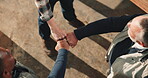 Carpentry, above and people with group fist, solidarity and team building in warehouse. Teamwork, support and architects with hands together, collaboration gesture and encouragement in woodworking.