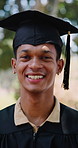 Happy, graduation and face of man with cap at university for goal, education or academic achievement. Smile, portrait and graduate student in mortarboard with pride for college milestone at campus.