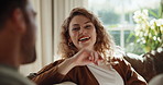 Laugh, love and couple in home for connection, conversation and bonding together with smile. Funny woman, man and care in living room with partner for commitment, happiness and playful with joke