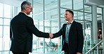 Business, partnership or people in agency with handshake, greeting or negotiation in b2b deal. Networking, smile or employees with shaking hands, introduction or opportunity with collaboration.
