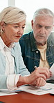 Documents, conversation and senior couple in home with planning for retirement funds or budget. Paperwork, calculator and elderly people with finance report for expenses, pension or asset management.