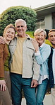 Happy family, face and new home on lawn for real estate, property or investment together outdoor. Portrait of senior parents and people with smile in garden for hug, relocation or bonding outside