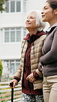 Senior, caregiver or walking patient with cane in park for outdoor bonding, healthcare or mobility. Nurse, smile or helping elderly woman with stick for assisted living, support or wellness in garden