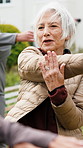 Senior, woman and stretching with coach in park for outdoor exercise, fitness or physiotherapy. Elderly, female person or warm up with instructor for health, vitality or wellness together in nature