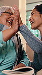 Nurse, high five and senior woman in home with book, word search and encourage for crossword. Smile, caregiver or old person in lounge with sudoku, answer success and achievement for puzzle activity