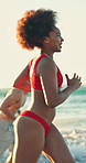 Fun, woman and friends at beach with running, good time and happy moment on summer break. Connection, waves and people at ocean with playful energy, group bonding and get together on outdoor getaway.