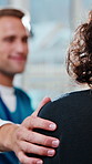 Health, hand and nurse with support to woman for follow up care, progress and treatment feedback. Shoulder, worker and comfort female patient in clinic for healthcare recovery, wellness and good news