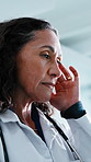 Doctor, woman and headache in clinic with stress, thinking and difficult decision for patient care. Healthcare worker, mature person and migraine in hospital with fatigue, burnout and medical crisis.