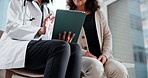 Doctor, consultation and hands with tablet in clinic, health and explaining test results to patient. Healthcare, medical professional and discussion with mature person, happy and diagnosis on website