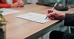 Person, hands and signature with ring for divorce, legal agreement or marriage settlement. People, lawyer or attorney with contract signing, form or document for prenuptial dismissal or termination
