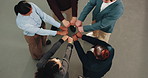 Above, business team and fist bump for solidarity with huddle, trust and support with motivation. Circle, hands together and people in office with community, collaboration and corporate goals 