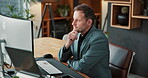 Reading, man and thinking with computer in office for market timing, trading decision or insight. Typing, mature trader and stocks review with tech for risk assessment, monitor trends or economy news
