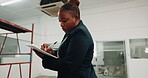 Writing, architect and clipboard with black woman in building for inspection, construction progress and review. Contractor, project code regulations and renovation evaluation with person for update