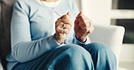 Arthritis, old woman or hands in house with stretching, joint tension or discomfort in muscle pain. Retirement, tendinitis and senior person with ache, chronic condition and osteoporosis in lounge.