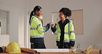 Architect, women or happy on construction site with fist bump, building progress or inspection pass. Tablet, team and celebration laugh for structural solution, permit clearance or architecture goals