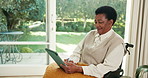 Tablet, smile and black woman in wheelchair at house with research, social media or reading blog. Digital technology, happy and mature person with disability on website for article on news in home.