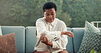 Black woman, massage and sofa on retirement with elbow pain, inflammation and symptoms of arthritis. Senior person, stretching and injury at house with muscle gout, rheumatic disease and osteoporosis