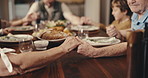 Praying, hands and family at dinner in home for religion, gratitude or thankful for food together. Grace, spiritual health and people at thanksgiving feast for worship, praise or blessing in house.