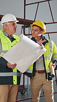 Construction, team and men with blueprint for planning, development layout or project coordination. Document, people and collaboration with engineer at site, building design or point for inspection