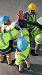 Happy, engineer and team with high five for construction, agreement and victory for architecture. Above, people and huddle with applause, inspection success and collaboration for building achievement