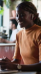 Woman, laptop and remote work in cafe with video call, wave and talk for digital marketing proposal. Happy, person and greeting in diner with computer, earphones and online meeting for freelancer.