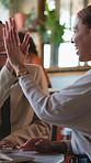 Happy, people and high five in restaurant with remote work, laptop and brand awareness achievement. Freelancer, women and talk in cafe with computer, campaign success and celebration for partnership.