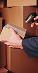 Scan, parcel and hands of delivery man with barcode, label and receipt for shipping information. Package, ecommerce and person with scanner for logistics, supply chain and courier service for invoice