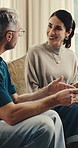 Mature, couple or discussion with tablet in home for online investment, network or connection. Man, woman or talking with technology on sofa for financial decision, option or choice together in house