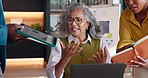 Stress, frustrated or woman with team in office with tablet, data or overwhelmed with deadline chaos. Mature person, overload or burnout on laptop for difficult challenge, notebook chart or overwork