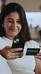 Credit card, phone and smile with woman on sofa for online shopping, digital payment or fintech. Internet banking, account password and customer purchase with person in living room of home for order