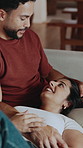 Love, relax and couple on couch with laugh, partner connection and bonding on weekend break. Support, chill and people in house with joke reaction, happy moment and day off in romantic relationship.

