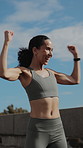 Fist pump, runner and woman in city with smart watch for fitness goals, exercise and celebration. Sports, athlete and happy person with running achievement, endurance and training with health stats