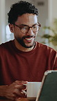 Man, reading and tablet at house for remote work, research and confirm facts for story submission. Smile, freelancer or coffee in home with tech, editing grammar and latest update of article coverage