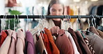 Boutique, choice and hands at clothes rack for shopping, outfit search or garment option on sale. Retail, woman and browsing display rail for apparel decision, store promotion and style for fashion