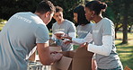 Charity, volunteer team and sorting in park for support, community service or donation for relief. Collaboration, NGO and people for help, aid package and grocery distribution in food nonprofit