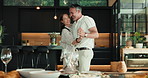Dance, happy and mature couple in home for bonding, connection and romantic moment with music. House, marriage and man with woman with spin, song and moving for relationship, love and commitment