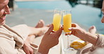 Cheers, juice and couple by pool at hotel for vacation, holiday and bonding on weekend getaway. Marriage, happy and man with woman toast with mimosa, alcohol and drink for love, break and travel