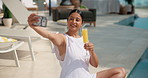 Woman, drink or swimming pool with selfie for holiday getaway, memory or vacation picture. Female person, relax and juice with photography for outdoor capture moment for summer break in luxury resort