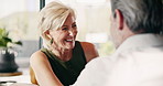 Laugh, home and mature couple for talking, conversation and chat for bonding, love and marriage. House, happy and man and woman with joke, humor and speaking for connection, trust and relationship
