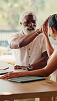 Finance, happy and interracial couple with high five in home for investment or budget success. Man, woman or smile with technology or paperwork for financial profit, winning or expenses in house