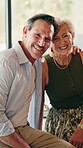 Happy, face and mature couple in home for bonding, commitment and connection in marriage. Smile, portrait and woman with man in living room for embrace, affection and love for loving relationship