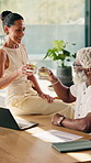 Finance, toast or interracial couple with drink in home for asset management or investment together. Man, woman or smile with laptop, paperwork or cheers for financial budget or insurance in house