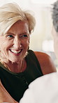 Laugh, talking and mature woman on sofa for connection, relationship and trust in marriage. Home, relax and people in conversation, speaking and chat for love, bonding and commitment on weekend