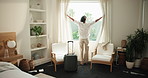Hotel, arrive and woman with suitcase by curtain for travel, accommodation and lodge for business trip. Hospitality, room and person with luggage, open and view for check in, reservation and booking