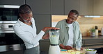 Smoothie, blender and senior mother with adult daughter for wellness, smile or high five for success. Happy, black women and elderly mom in kitchen with machine, green juice and healthy diet in home.