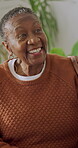 Old woman, support and laughing with daughter in lounge, discussion and together on weekend in home. Senior parent, talk and family connection on break, comfort and happy black people in living room